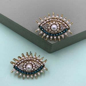 - Eye earrings studs pearls